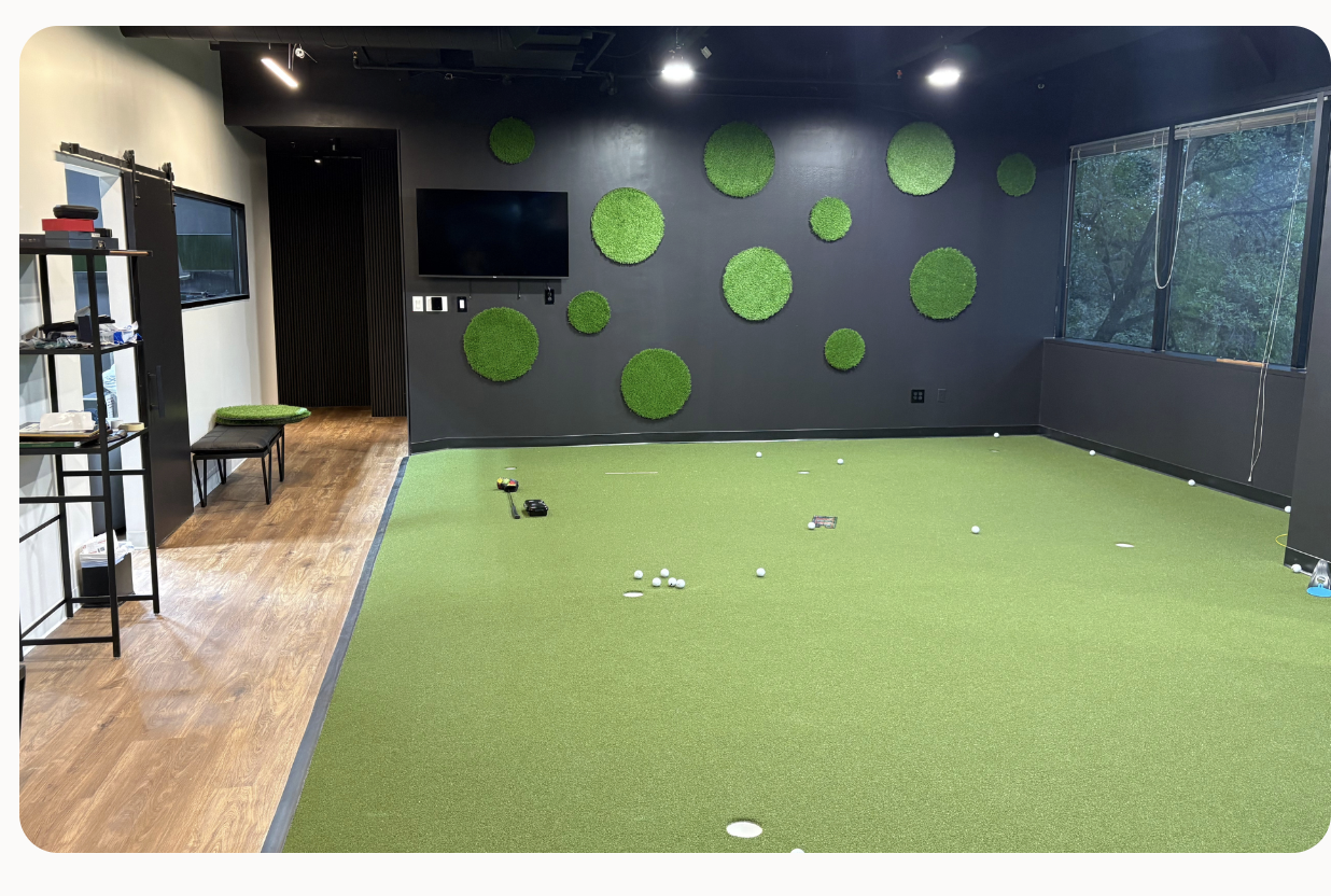 Indoor practice putting green at the ATX Golf Performance coaching studio in Austin, Texas